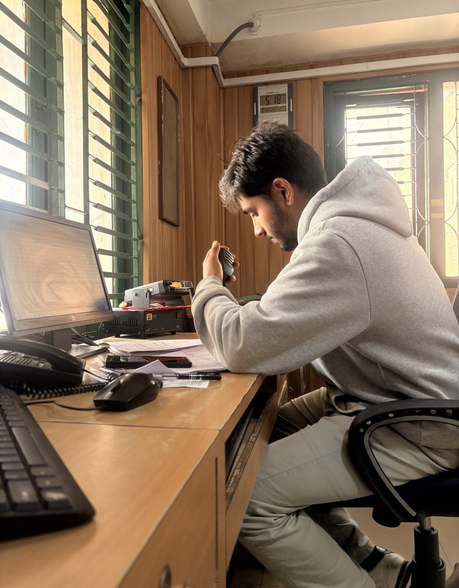 Bishal communicating with aircraft pilots over VHF radio during his OJT at Yeti Airlines