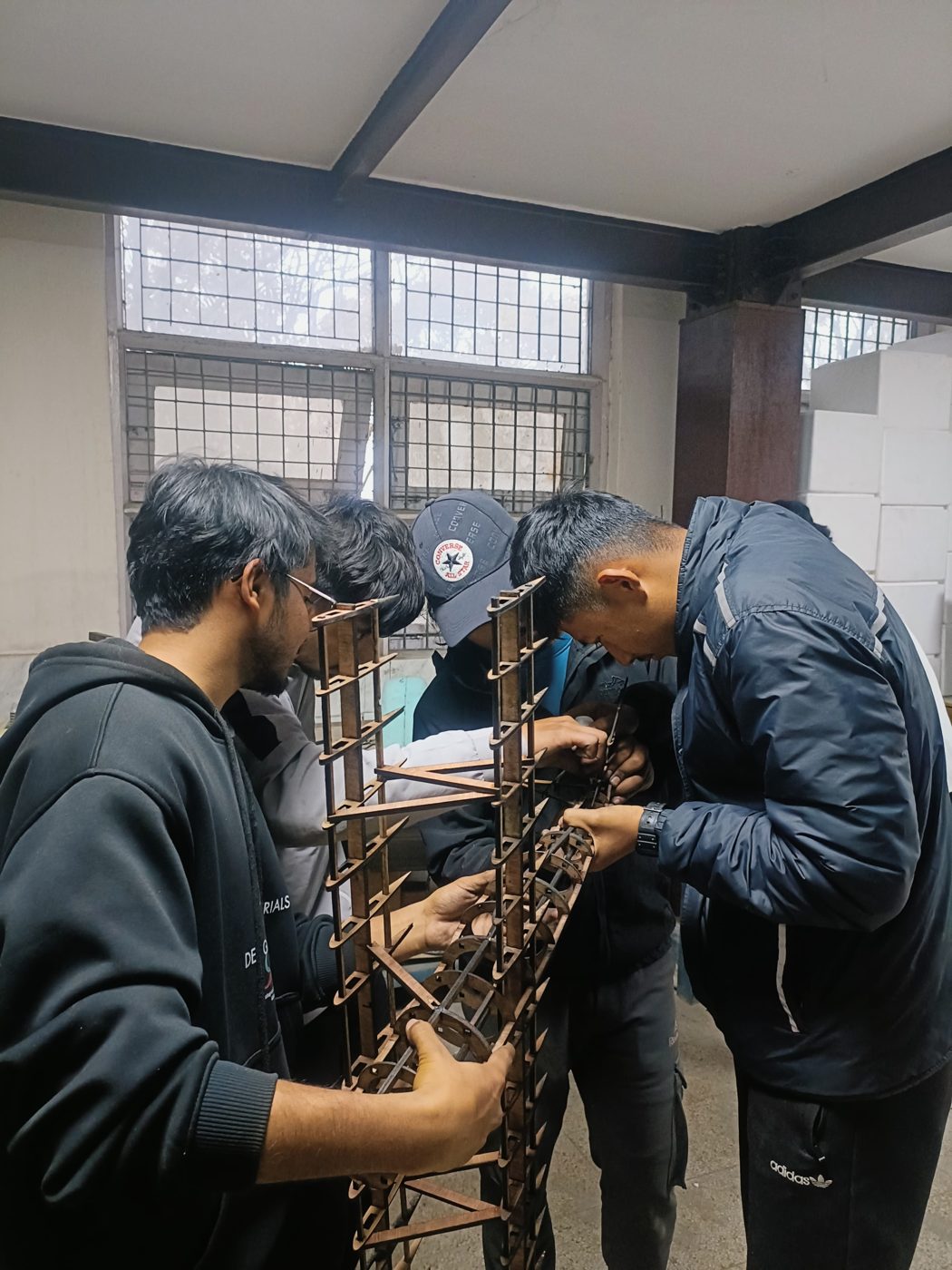 Team assembling the fuselage on the building board